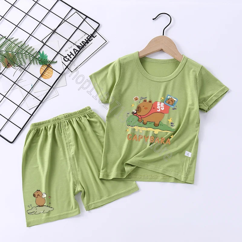 Green children's capybara pajama set with cartoon design on a white background