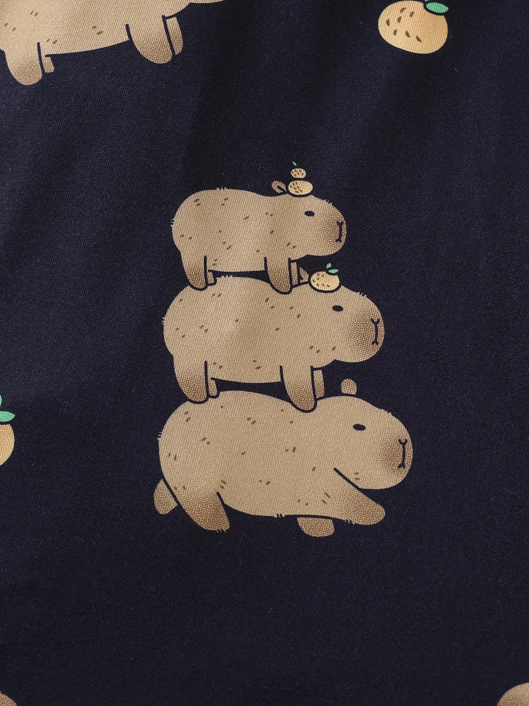 Navy fabric with beige capybara illustrations