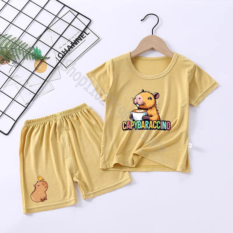 Children's yellow outfit with cartoon capybara character on a white background